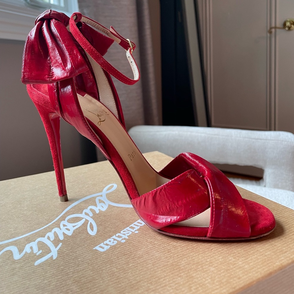 Christian Louboutin red suede and leather bow pump. Red shoes. Red bottoms.
